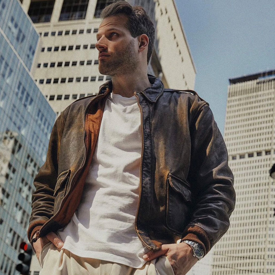 Brown leather jacket on a white background