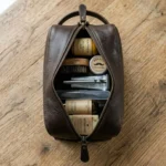 Nomad Dark Brown Leather Dopp Kit top view on a desk - Rove Leather
