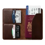 Men's full-grain distressed brown leather passport holder open showing US passport, 4 card slots and dual boarding pass pockets — Rove Leather