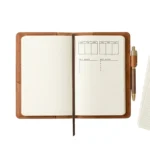 Close-up of hand-stitched edge detail on full-grain cognac leather journal cover by Rove Leather